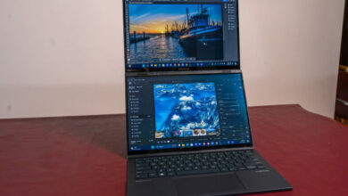 Asus Zenbook Duo 2026 review product photo for Numerello showcasing dual 14-inch 3K OLED touchscreens, detachable Bluetooth keyboard, and Intel Core Ultra callouts.