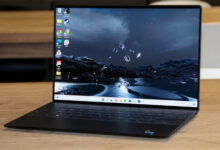 Dell XPS 13 Plus 2026 review product photo for Numerello showcasing the 3.2K OLED InfinityEdge display, seamless glass haptic touchpad, and Intel Core Ultra performance callouts.
