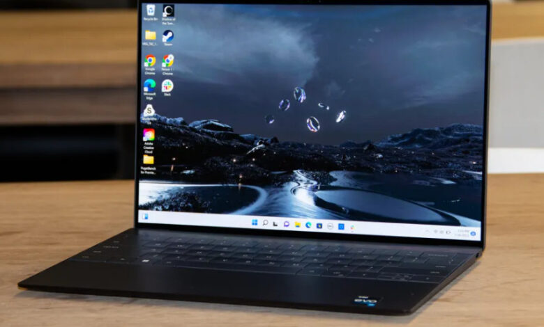 Dell XPS 13 Plus 2026 review product photo for Numerello showcasing the 3.2K OLED InfinityEdge display, seamless glass haptic touchpad, and Intel Core Ultra performance callouts.