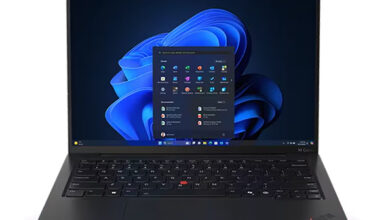 Lenovo ThinkPad X1 Carbon Gen 13 review product photo for Numerello showcasing the 2.8K OLED display, carbon fiber chassis, and Intel Core Ultra processor callouts on an executive desk.